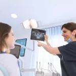 dental assistant showing xray